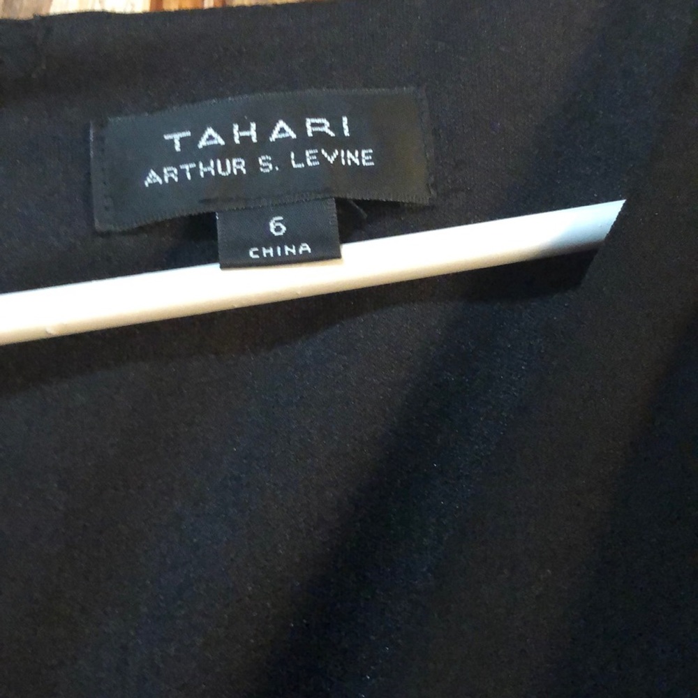 Tahari black dress. Worn once.  Mid length sleeves